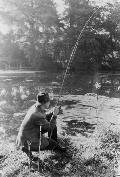 Dick Walker fishing with a rod of his own making